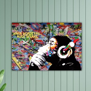 May include: A vibrant graffiti art print featuring a chimpanzee wearing headphones. The artwork includes the quote "When words fail music speaks" by Shakespeare. The background is a colorful explosion of graffiti art.