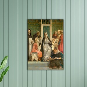 May include: A framed print of a historical painting showing a queen in a silver gown and crown, surrounded by figures in robes. The artwork features a detailed, classical style with rich colours and textures, set against a detailed background.