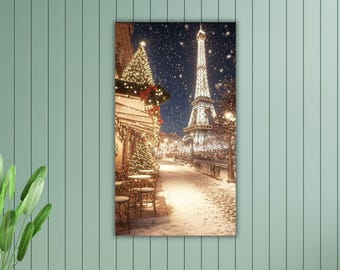May include: A vertical print showing the Eiffel Tower in Paris at night during a snowfall. The tower is lit up, and the street is lined with Christmas lights and snow-covered trees. A cafe is decorated with lights and a Christmas tree.
