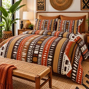 May include: A bedding set featuring a duvet cover and two pillowcases with a repeating vertical stripe pattern in shades of burnt orange, dark brown, tan, and cream. The fabric displays geometric shapes, including dots, dashes, and rectangles.