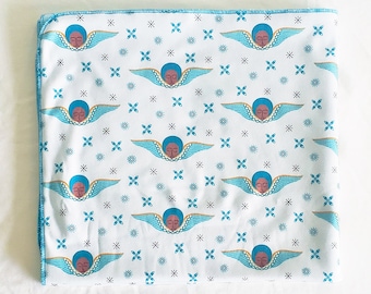 Organic Cotton Knit Blue Baby Angel Blanket; Black baby angel character inspired by traditional Ethiopian art and design