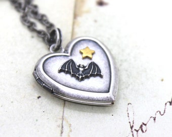 bat  and star. locket necklace. silver ox jewelry and gold ox star