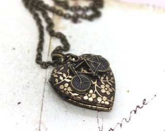 bicycle. heart locket necklace. in brass ox with floral pattern