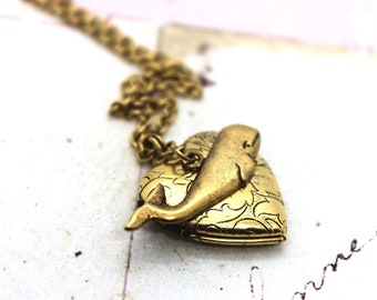 whale. heart locket necklace. in gold ox tapestry pattern