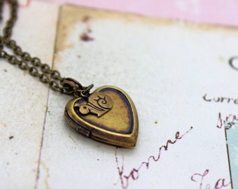 snail. heart locket necklace. brass ox jewelry