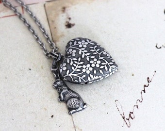 rabbit. heart locket necklace. in silver ox with floral locket