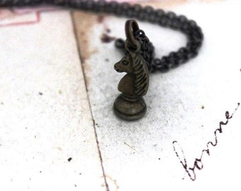 chess piece necklace. antiqued brass tone