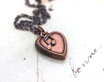 music note. heart locket necklace. in copper ox small notes