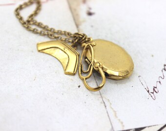 nurse locket necklace. in gold ox oval locket