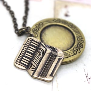 accordion locket. round necklace. brass ox jewelry with floral pattern