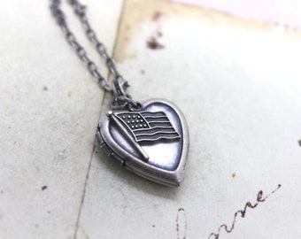 flag. heart locket necklace. silver ox