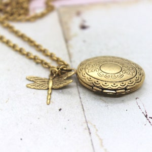 dragonfly. oval locket necklace. in gold ox jewelry