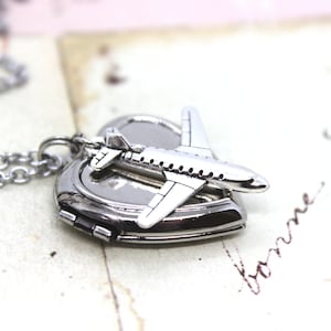 airplane. heart locket necklace. antiqued shiny silver tone jewelry
