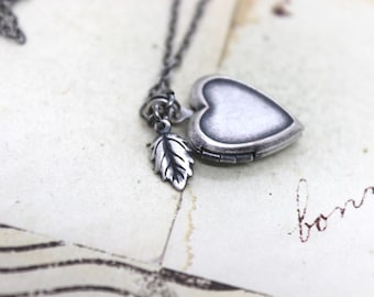 leaf locket necklace. silver ox