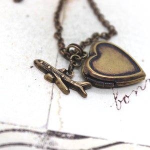 tiny airplane. locket necklace. in brass ox image 3