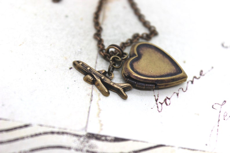 tiny airplane. locket necklace. in brass ox image 3