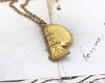 oil well. oval locket necklace. gold ox jewelry