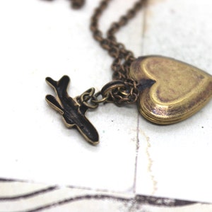 tiny airplane. locket necklace. in brass ox image 4