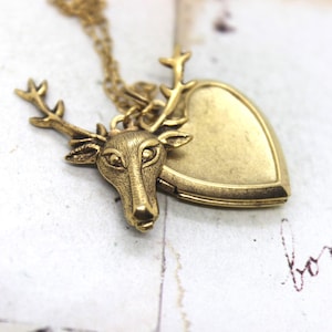 deer. heart locket necklace. in gold ox jewelry with antlers
