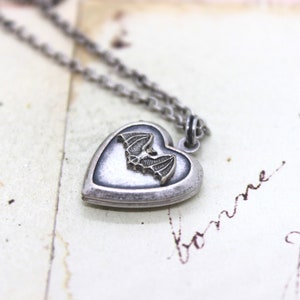 bat. heart locket necklace. silver ox jewelry with silver tone bat antiqued
