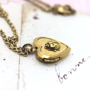 ladybug. heart locket necklace. gold ox ladybug