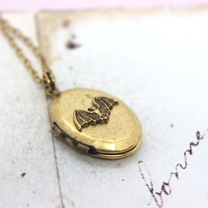 bat. locket necklace. gold ox jewelry oval locket
