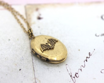 bat. locket necklace. gold ox jewelry oval locket