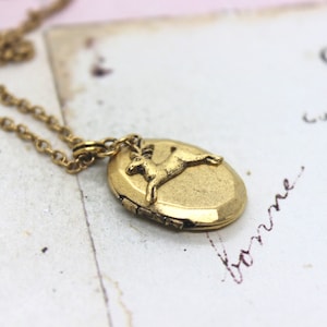deer. oval locket necklace. in gold ox jewelry