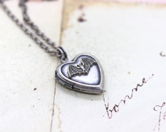 bat heart locket necklace. silver ox jewelry with silver tone bat or silver ox bat