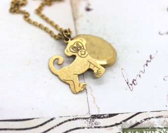 monkey. oval locket necklace. in gold ox jewelry larger monkey