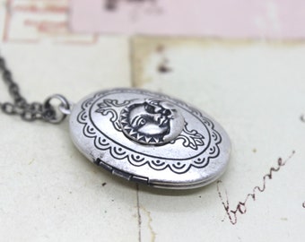 sun and moon. oval locket necklace. in silver ox jewelry