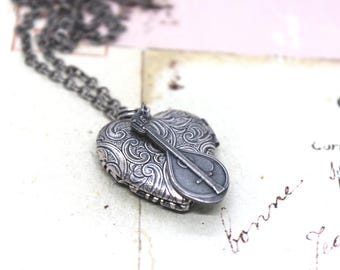 mandolin locket necklace. silver ox jewelry tapestry pattern