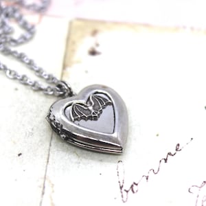 bat. heart locket necklace. in antiqued shiny silver tone