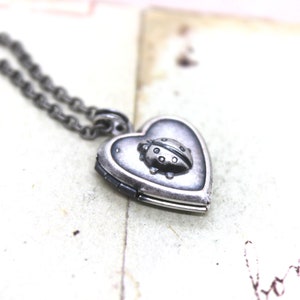 ladybug. locket necklace. in silver ox image 1