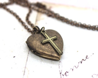 cross. heart locket necklace. in brass ox with etched lines locket