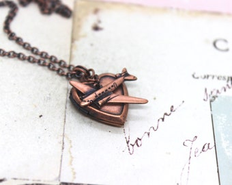 airplane. heart locket necklace. copper ox