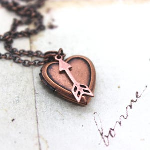 arrow. locket necklace. in copper ox