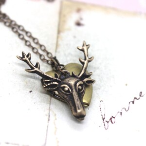 deer. heart locket necklace. in brass ox jewelry with antlers