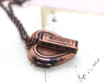 harmonica. heart locket necklace. copper ox medium weight jewelry