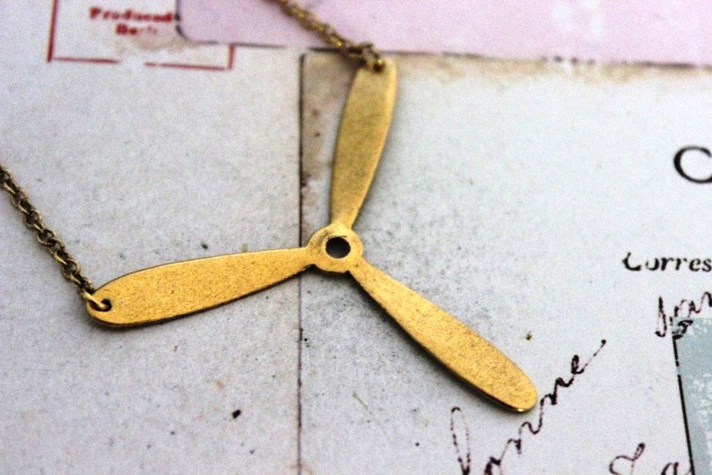 propeller. necklace. gold ox jewelry image 1
