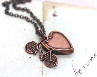 bike. heart locket necklace. copper ox