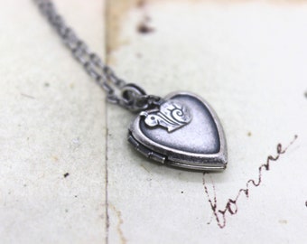 snail. heart locket necklace. silver ox