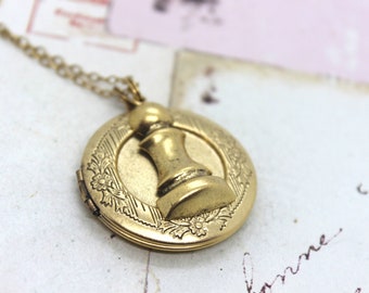 pawn locket. round necklace. gold ox jewelry with floral pattern