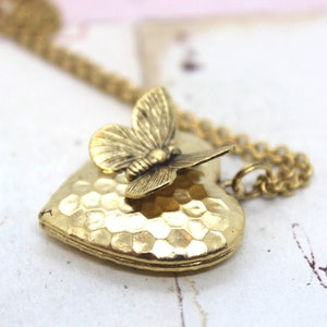butterfly. heart locket necklace. in gold ox with hammered pattern locket