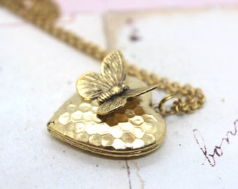 butterfly. heart locket necklace. in gold ox with hammered pattern locket