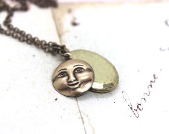 moon face. locket necklace. in brass ox