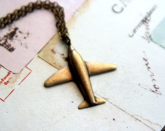 in flight. airplane necklace. brass ox