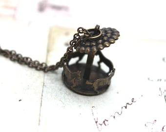 carousel horse. necklace. brass ox