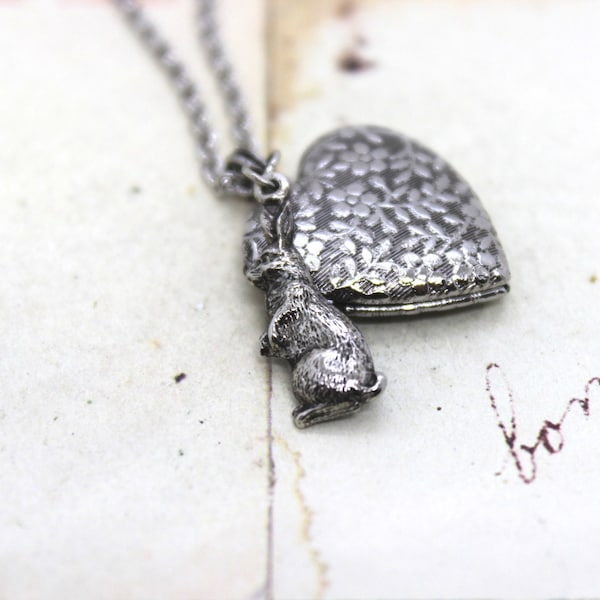 rabbit. heart locket necklace. in antiqued shiny silver tone with floral vines pattern