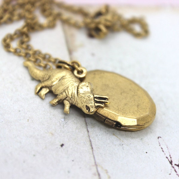 triceratop locket necklace. gold ox jewelry